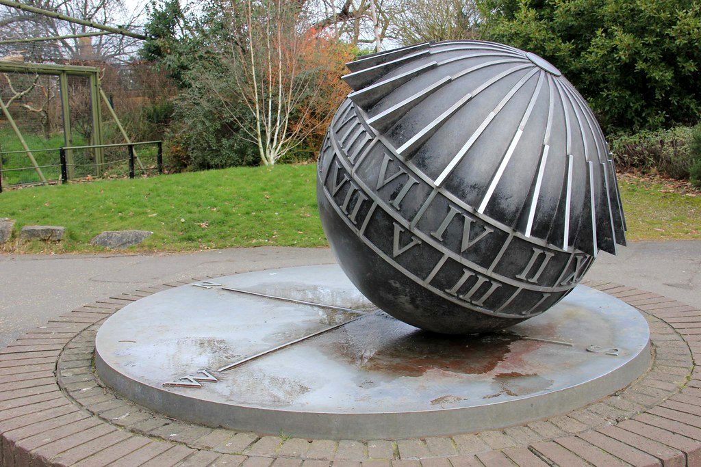 A tranquil formal garden with a sculptural centrepiece