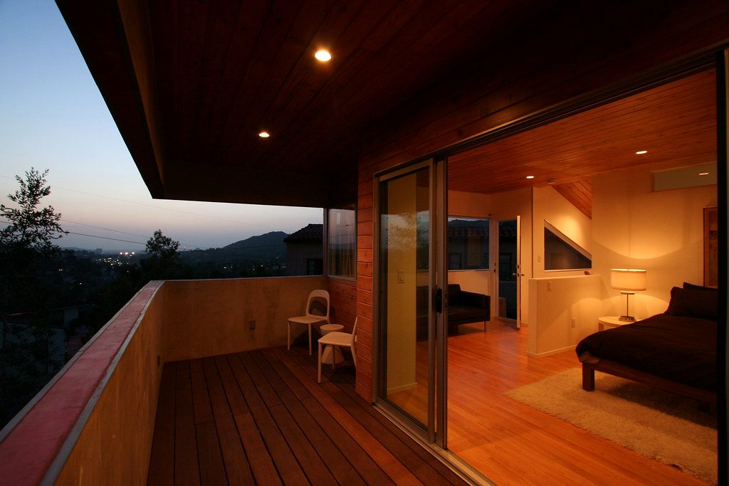 A warm timber-lined home opening onto a private outdoor deck